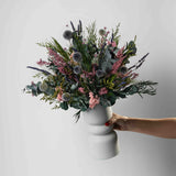 MARION - PRESERVED PURPLE AND LILAC WILD MIXED FLOWER ARRANGEMENT IN WHITE VASE
