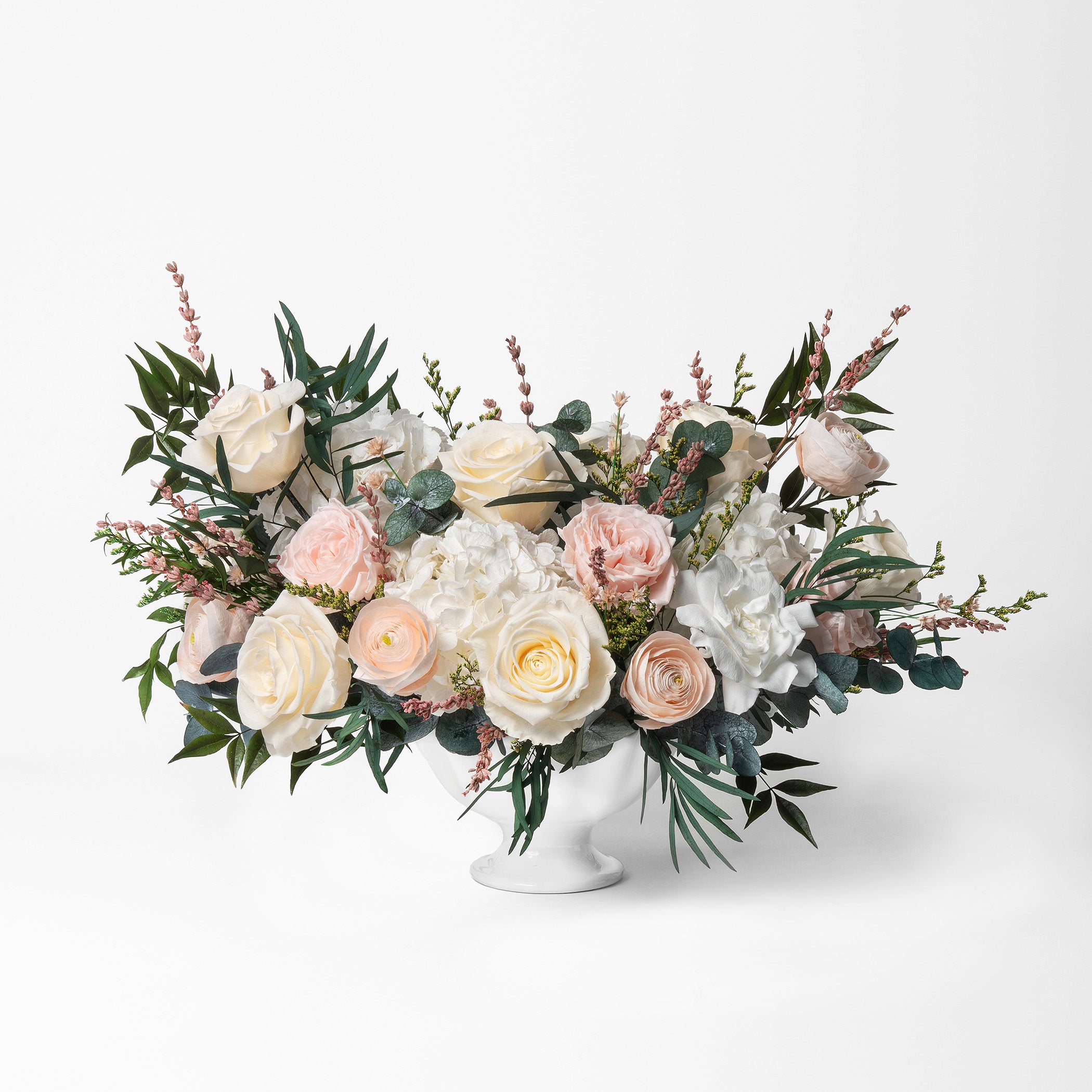 PRESERVED BLUSH AND WHITE MIXED FLOWER ARRANGEMENT IN WHITE CERAMIC VASE
