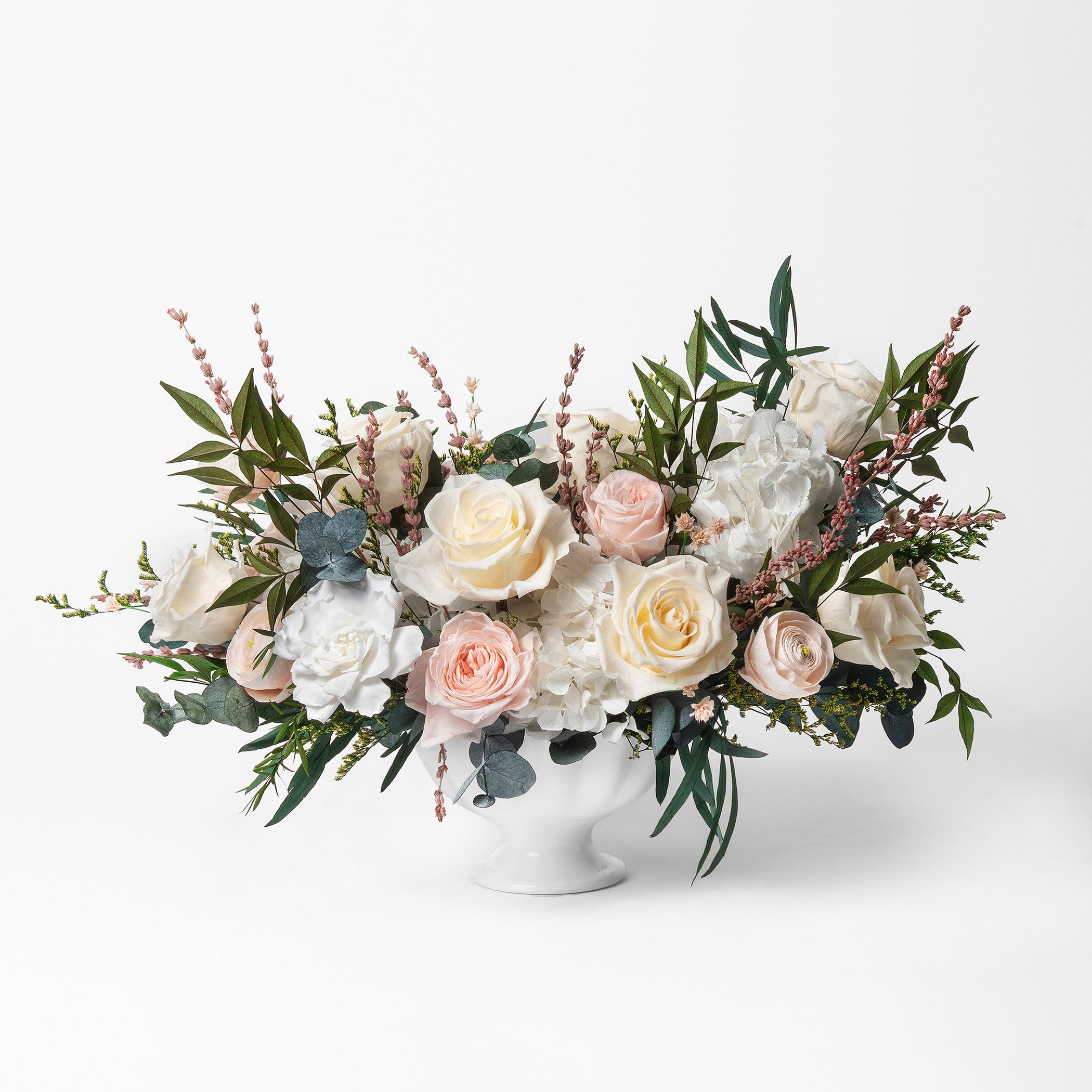 PRESERVED BLUSH AND WHITE MIXED FLOWER ARRANGEMENT IN WHITE CERAMIC VASE
