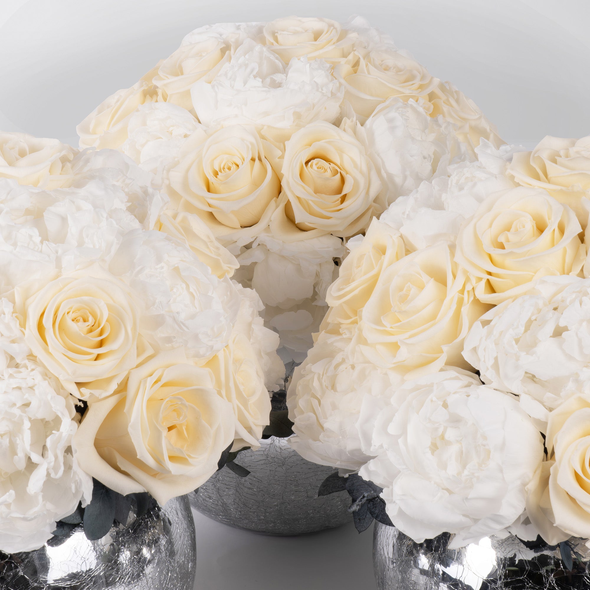 PRESERVED WHITE ROSE AND PEONY DOME ARRANGEMENT IN SILVER VASE
