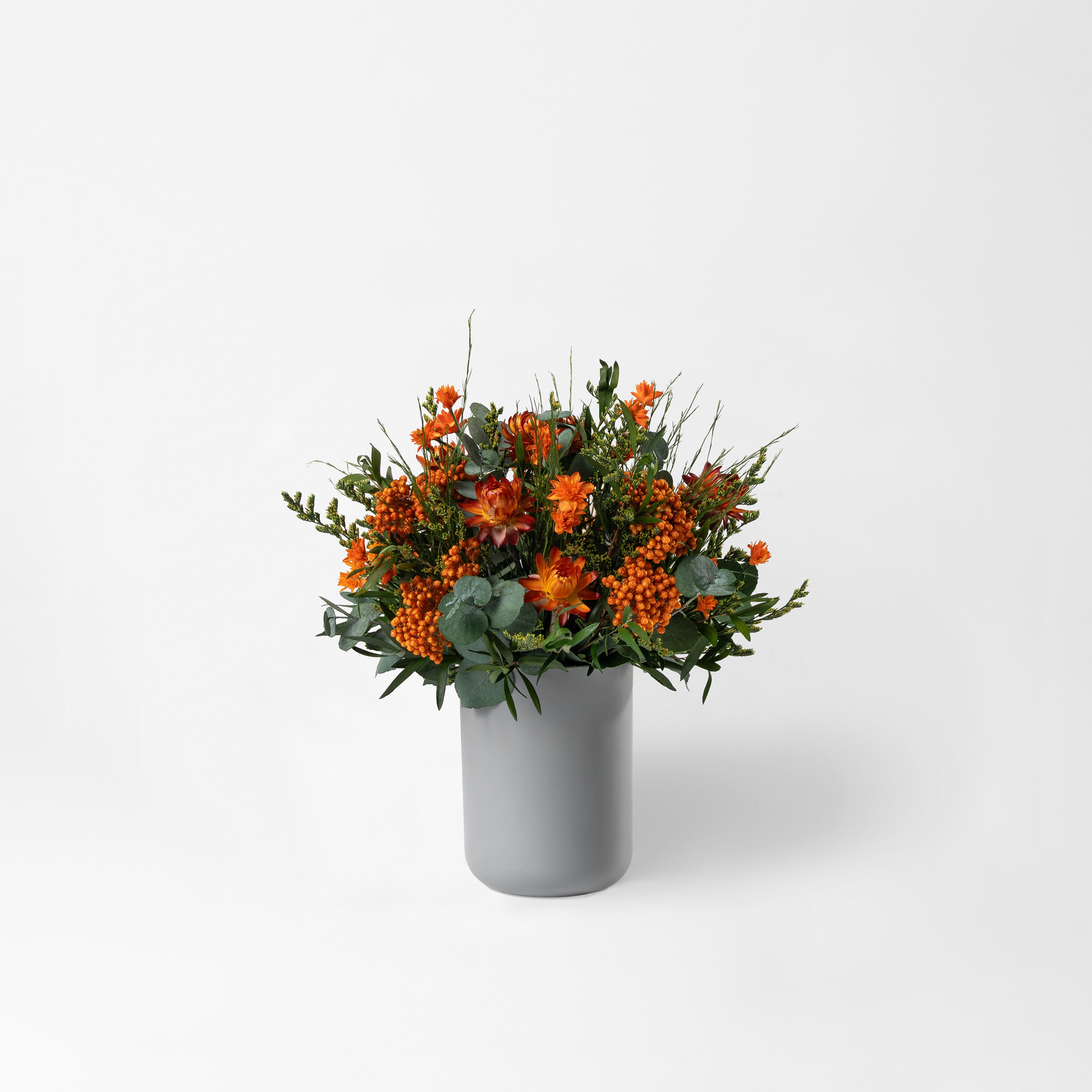 PRESERVED ORANGE WILD MIXED FLOWER ARRANGEMENT IN GREY BAMBOO VASE