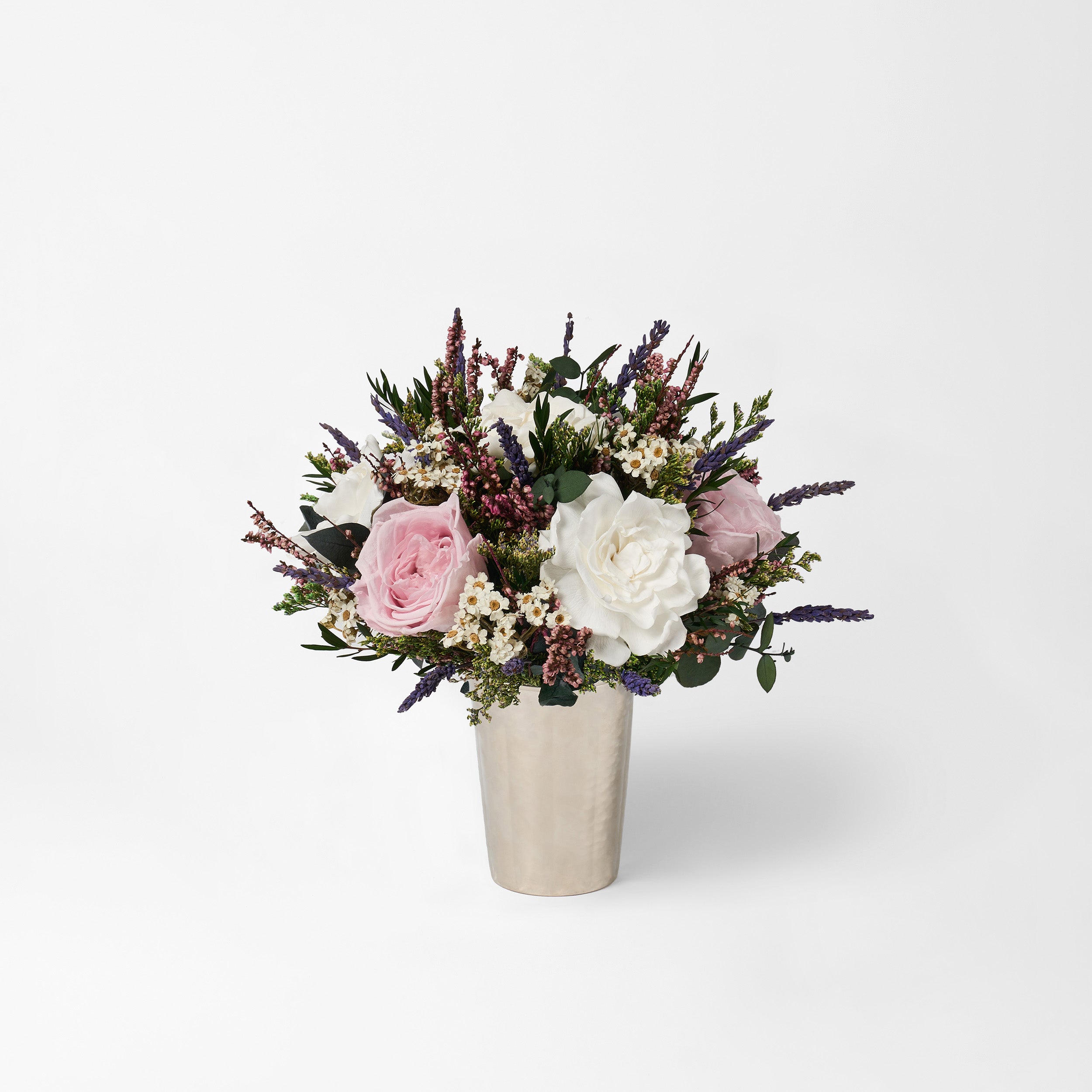 PRESERVED WHITE AND LILAC MIXED FLOWER ARRANGEMENT IN SILVER VASE