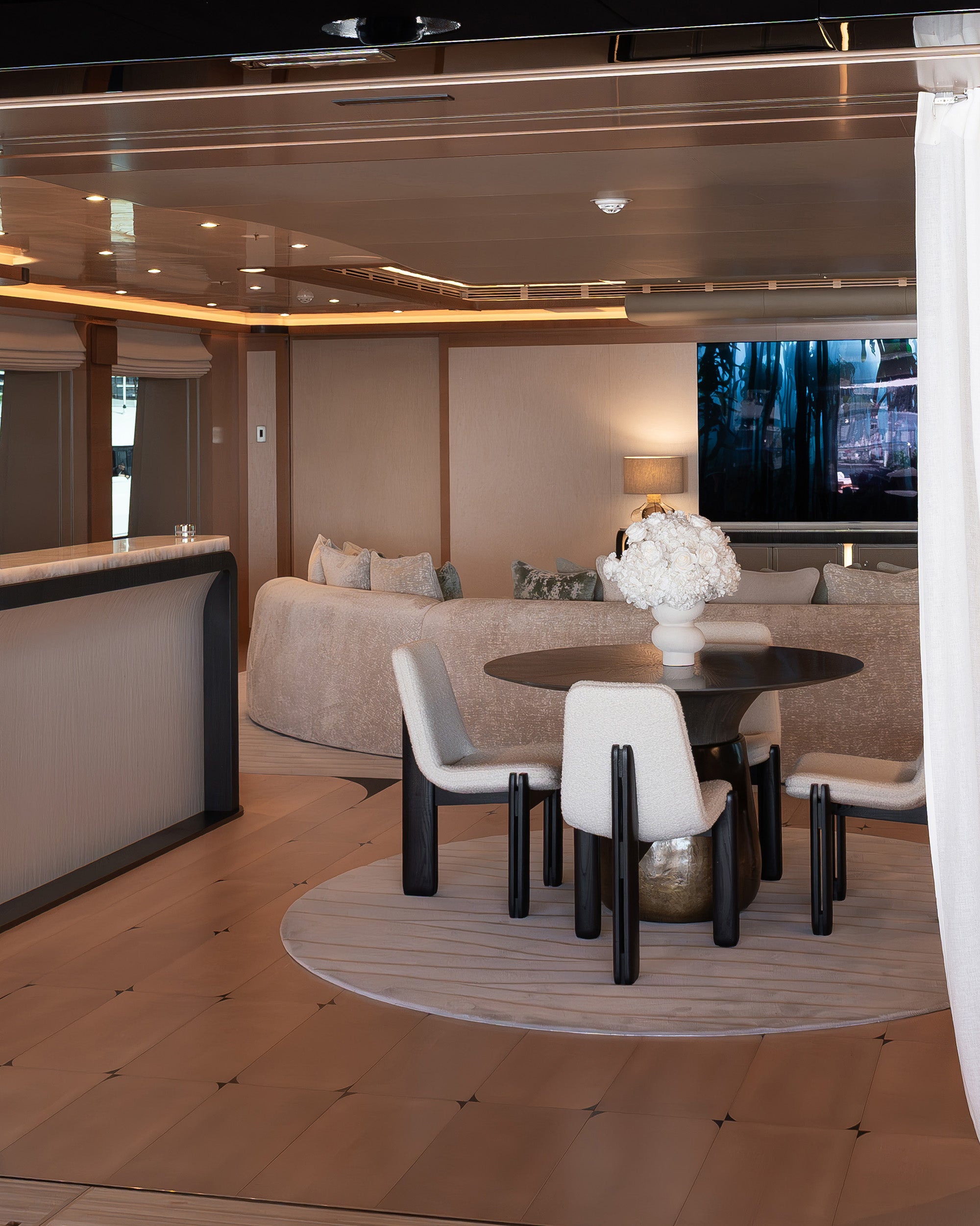 Preserved white hydrangea and roses arrangement in the main salon of a yacht