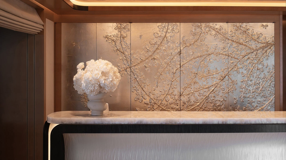 Preserved hydrangea and rose arrangements displayed on the bar in the yacht’s main saloon