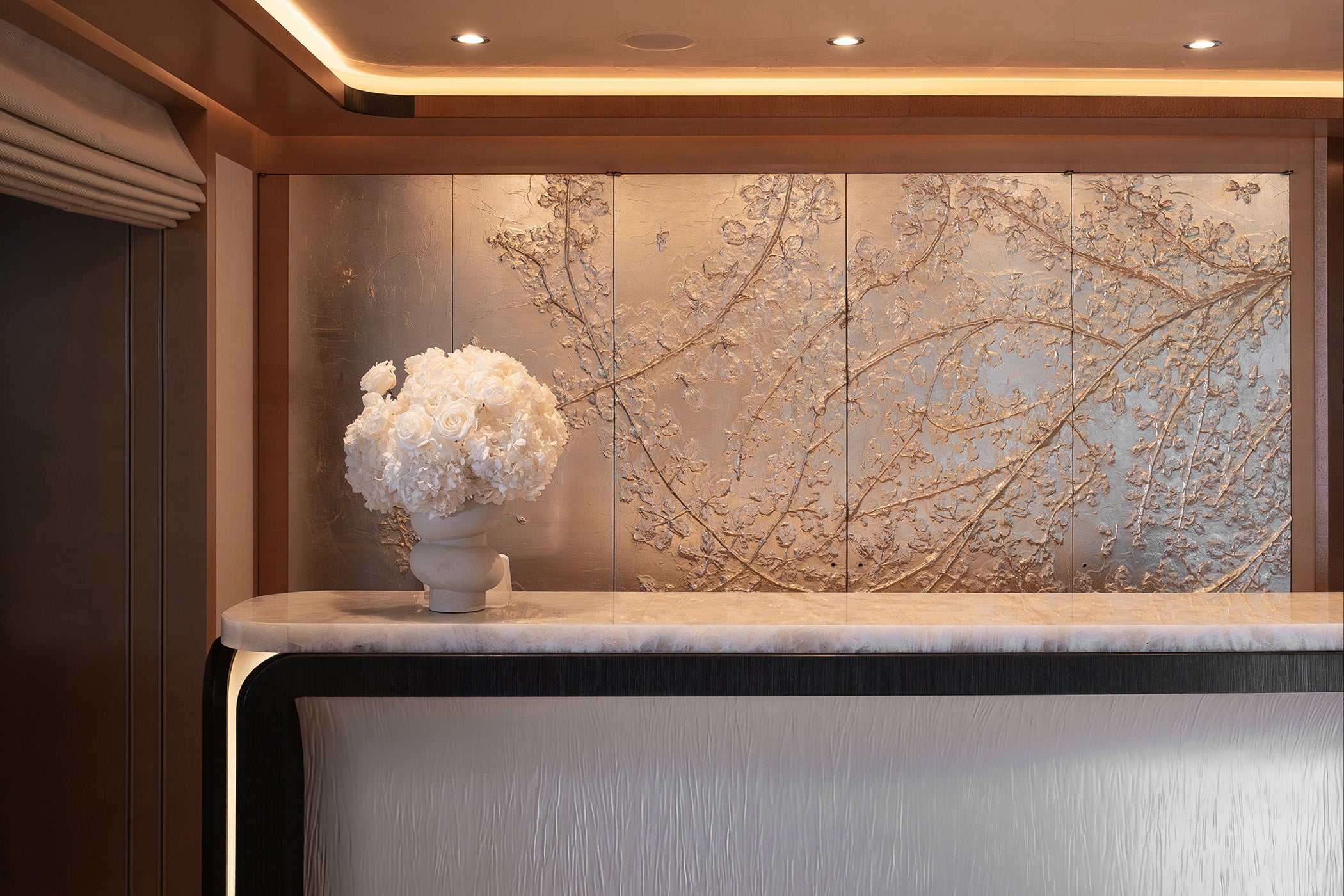 Preserved hydrangea and rose arrangements displayed on the bar in the yacht’s main saloon