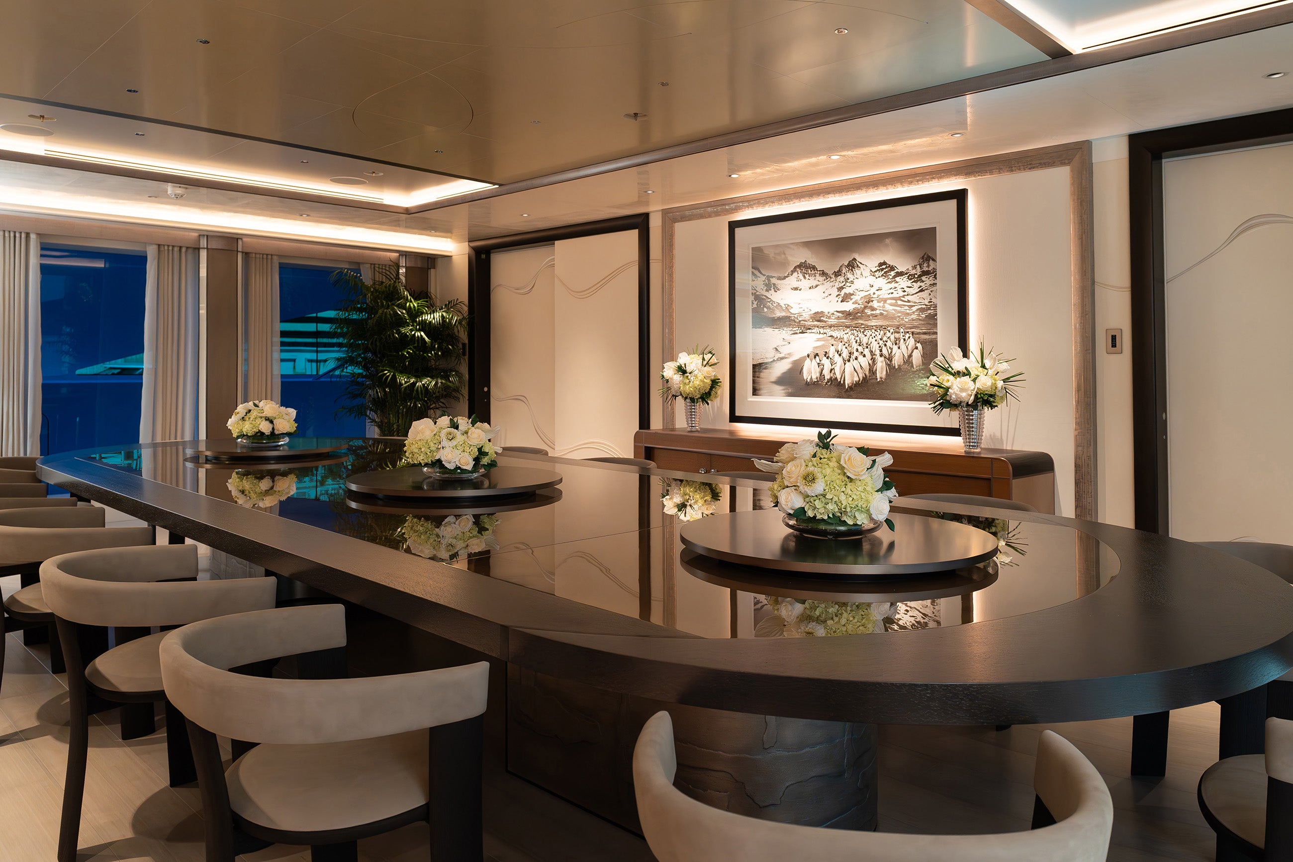 Preserved mixed flower arrangements in the main salon dining area of a yacht