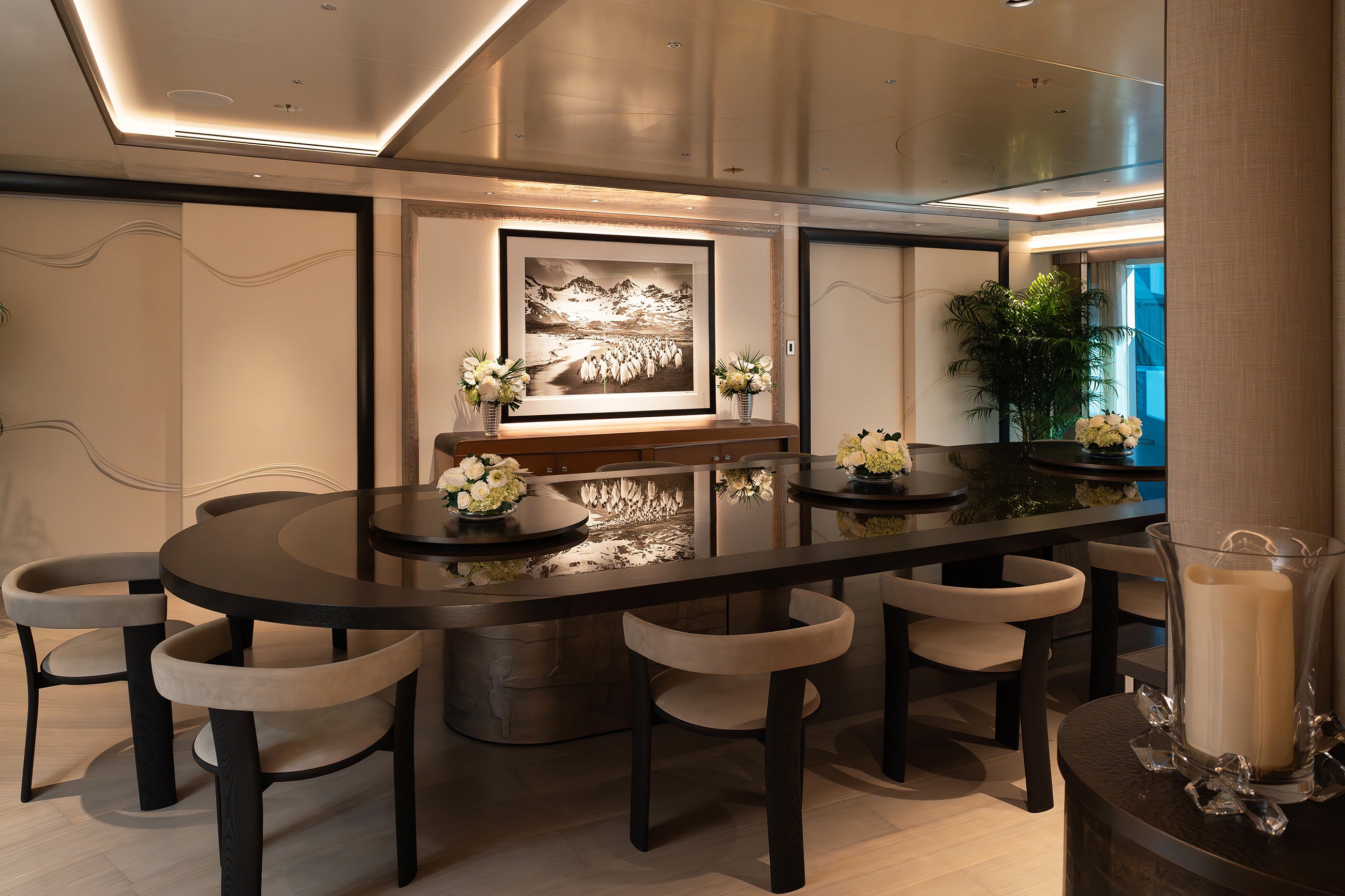 Preserved mixed flower arrangements in the main salon dining area of a yacht