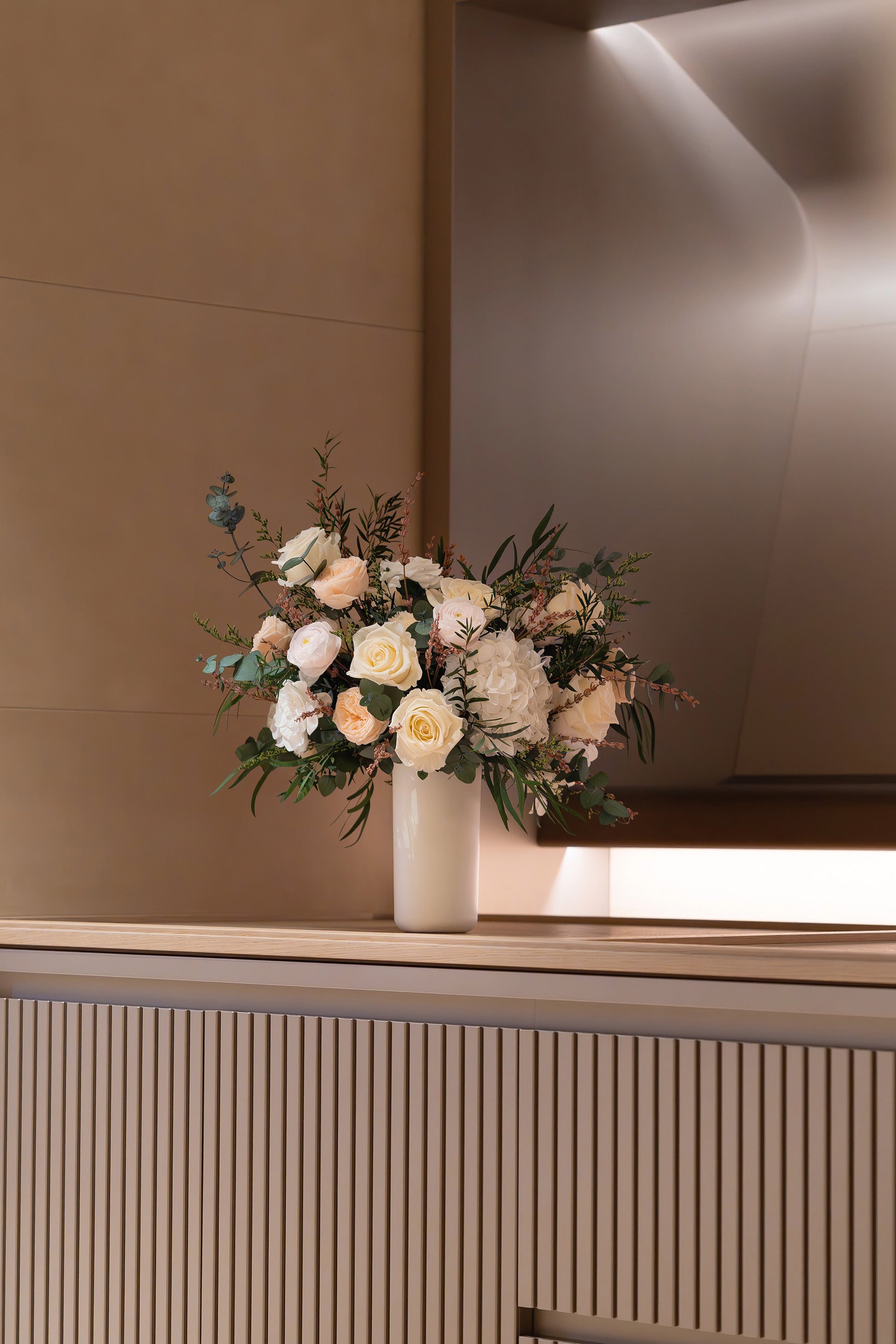 Preserved mixed flowers asymmetrical arrangement in master cabin