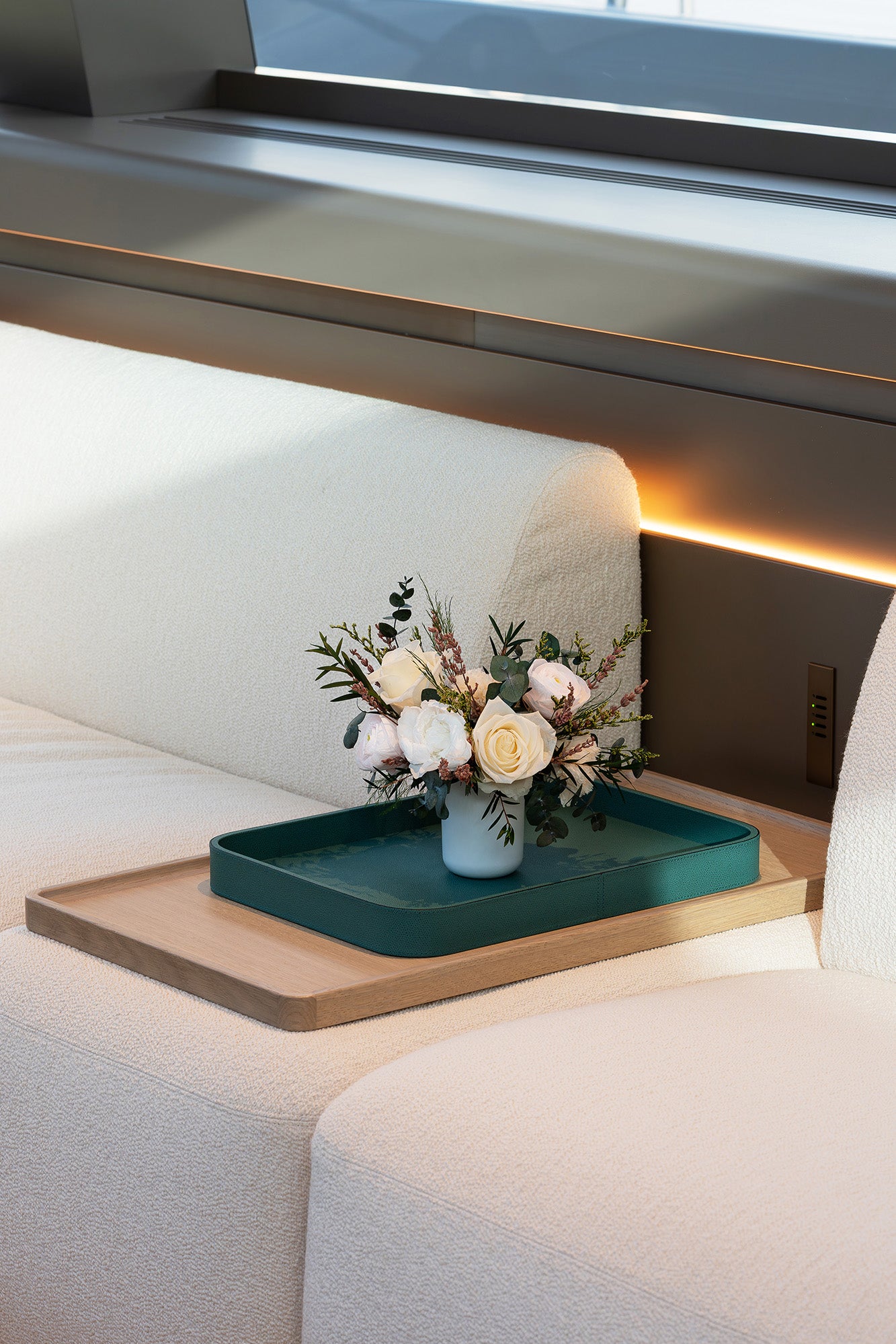 Preserved small mixed flowers arrangement on sailing yacht