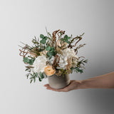 PRESERVED WHITE AND PEACH WILD MIXED FLOWER ARRANGEMENT IN STONE VASE