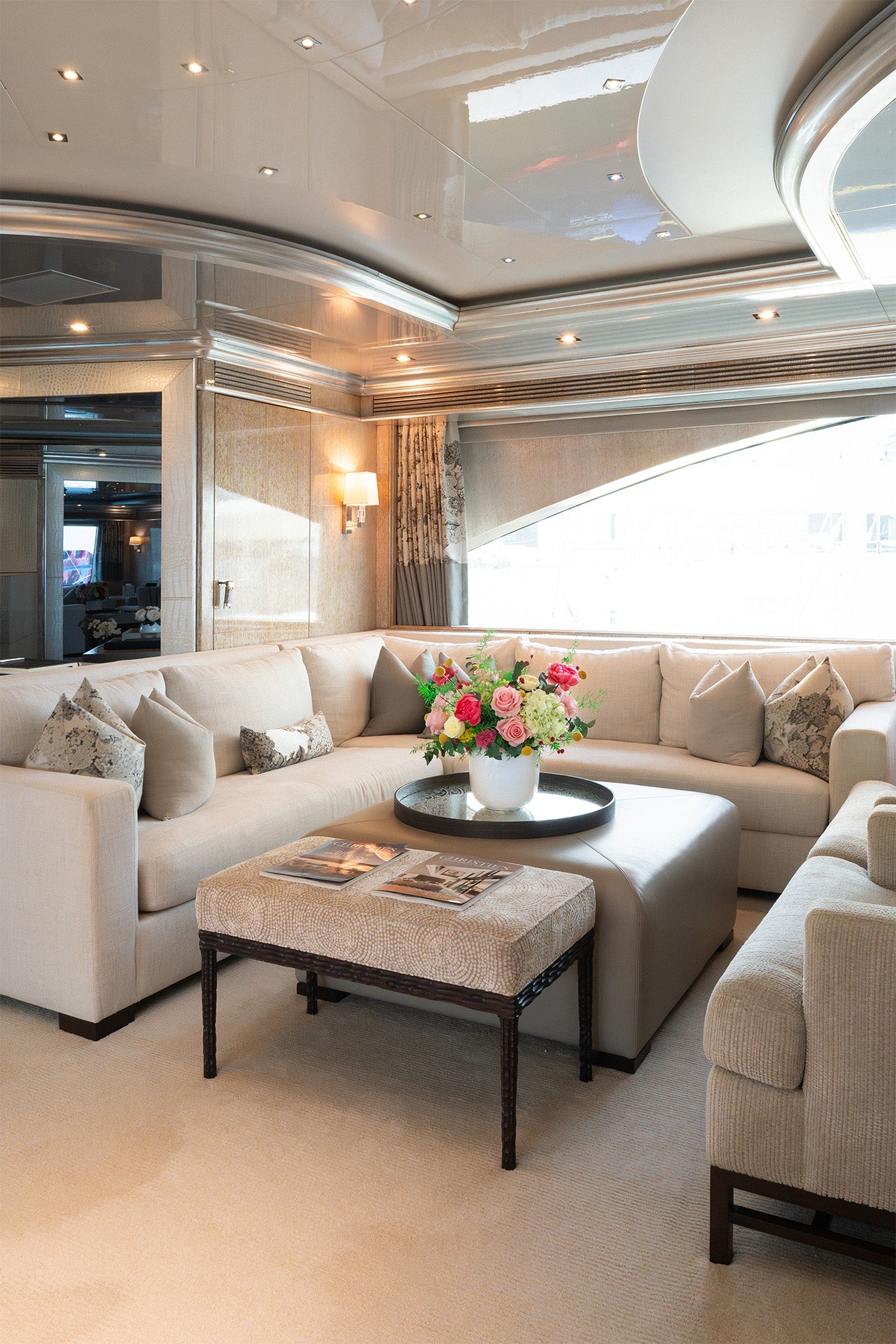 Long lasting preserved arrangement with preserved roses, peonies and hydrangeas in a vase on board a yacht