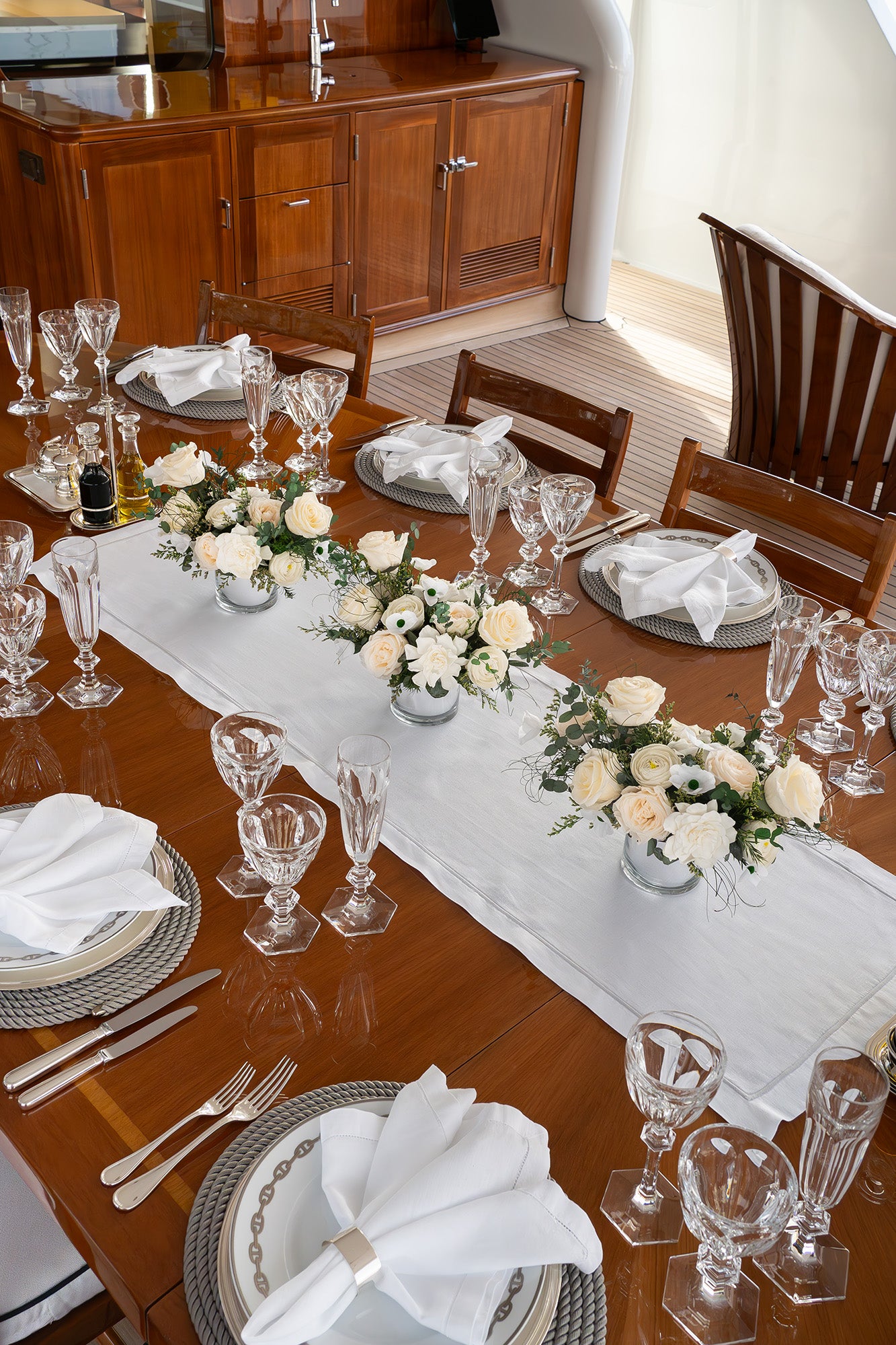 Preserved mixed flower arrangement on dining table 