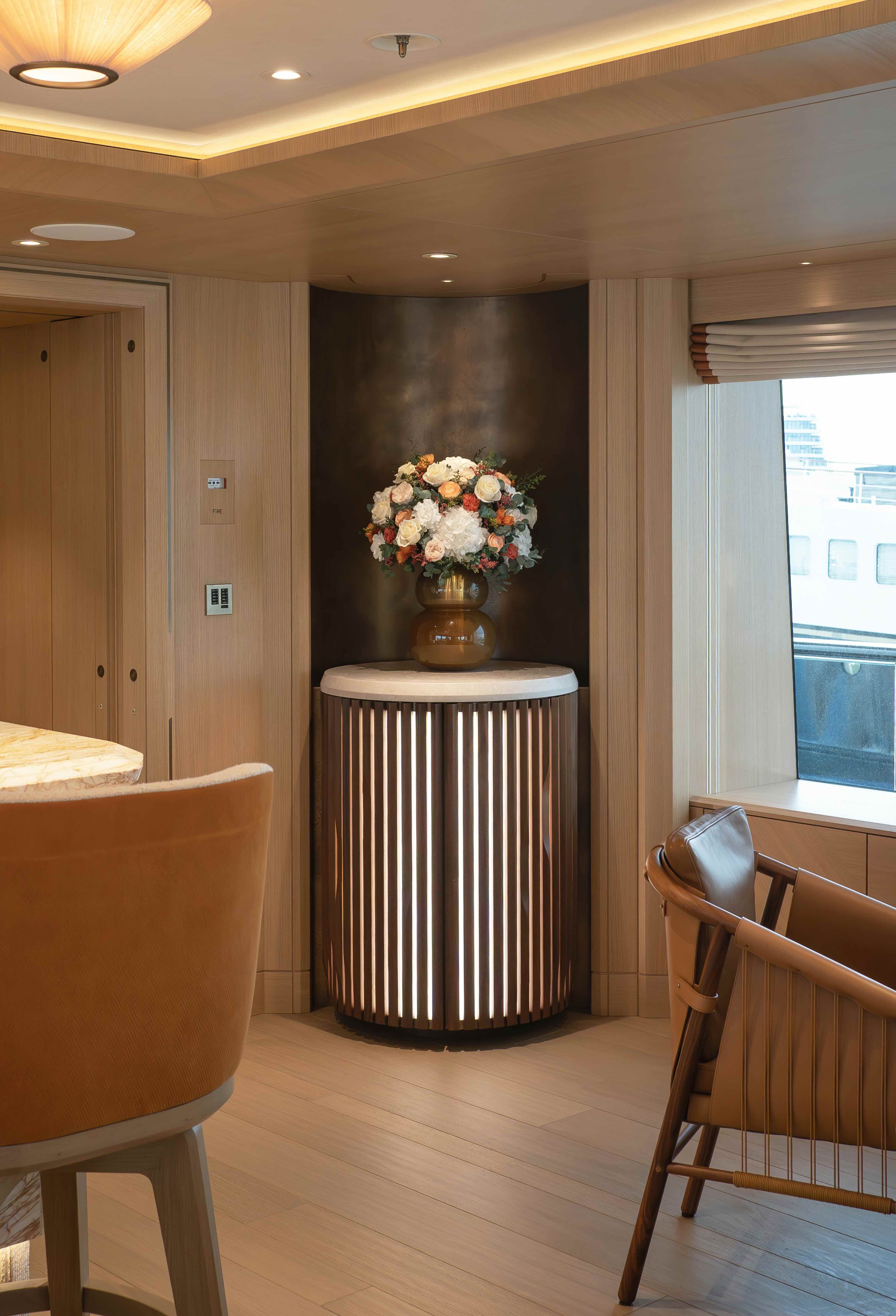 Mixed preserved arrangement in main salon of a yacht
