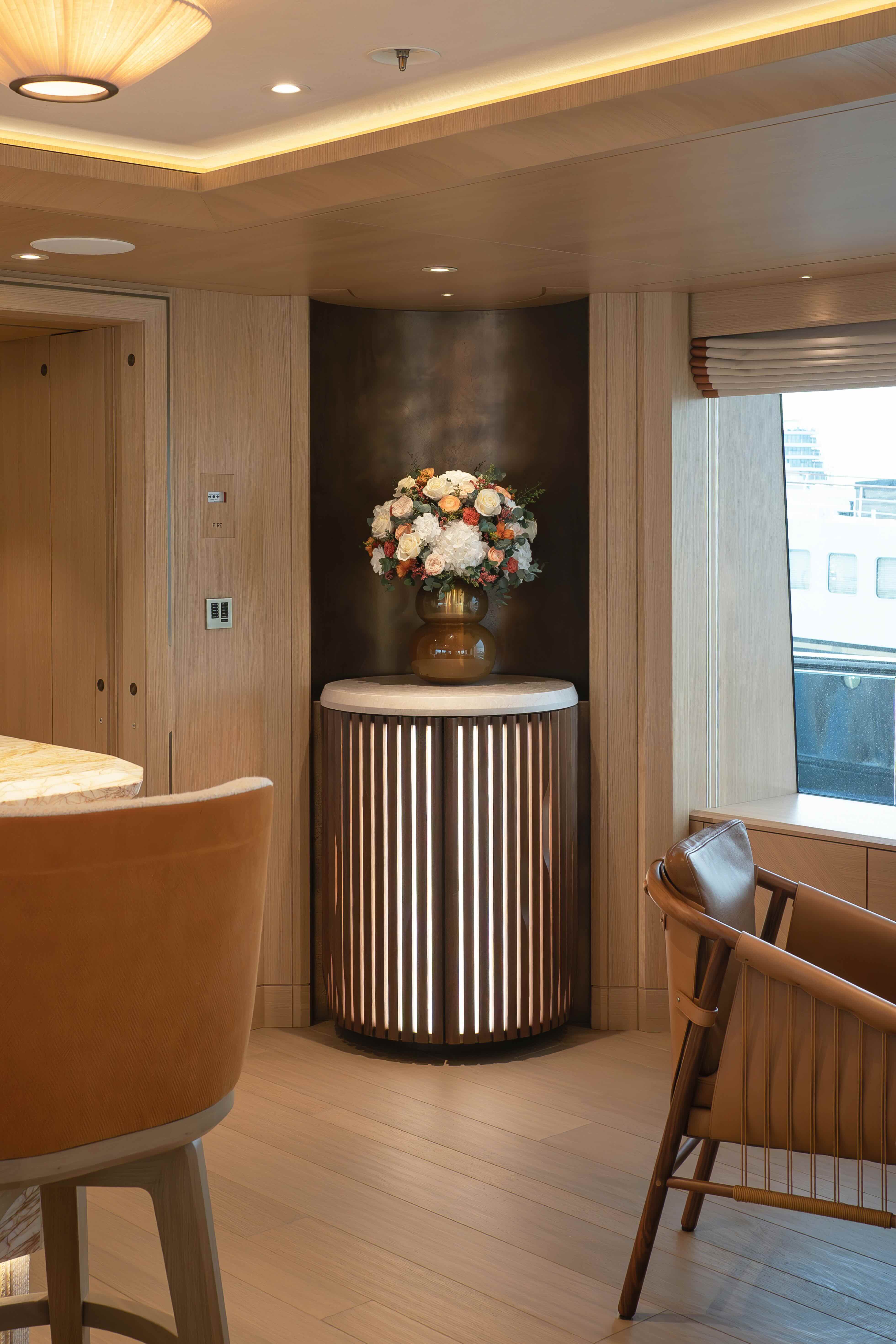 Mixed preserved arrangement in main salon of a yacht
