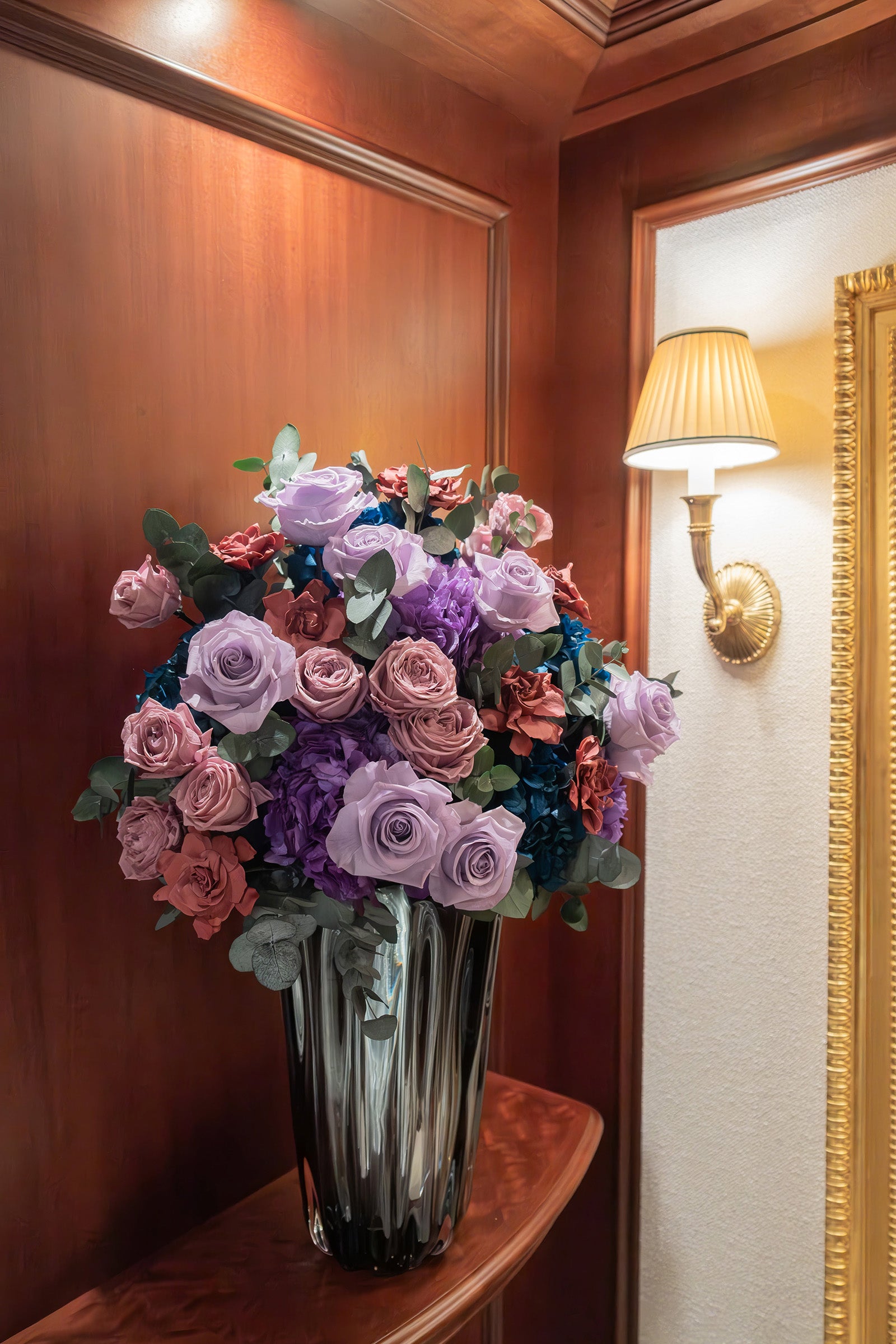 Preserved lilac rose, hydrangea and gardenia arrangement in foyer