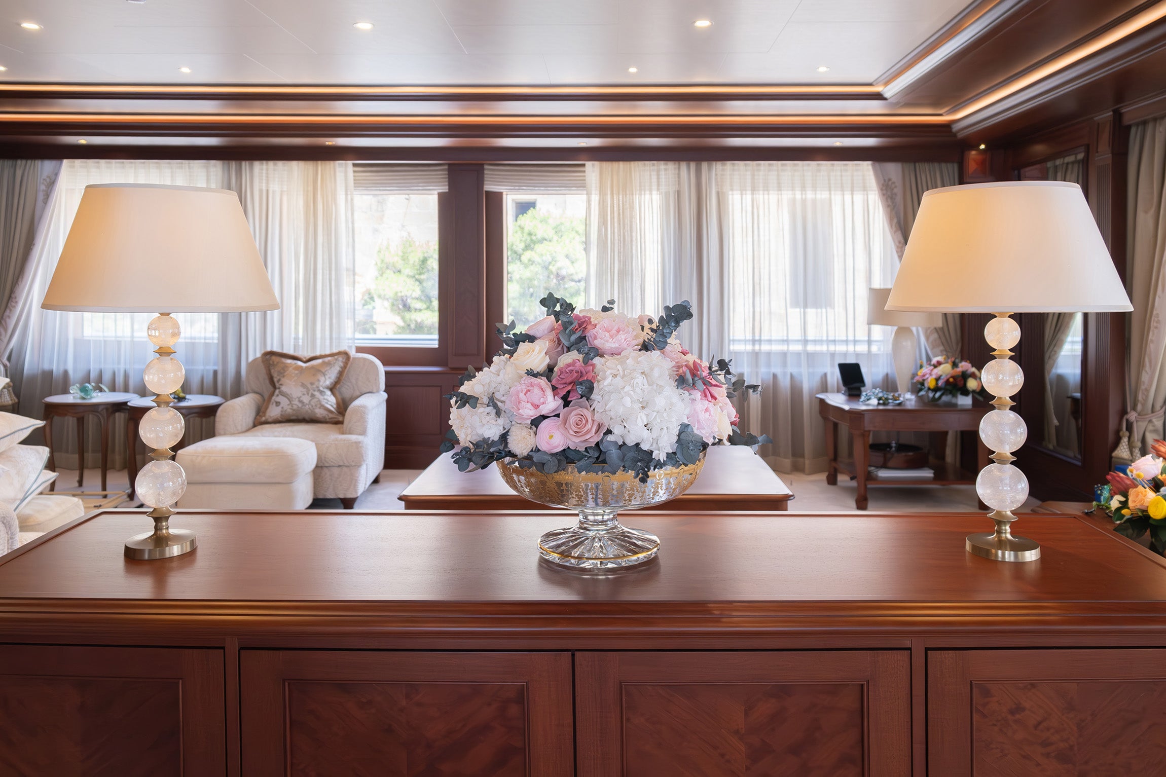 Preserved pink and white mixed arrangement in glass vase in main salon