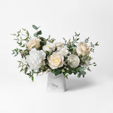 PRESERVED WHITE MIXED FLOWER ARRANGEMENT IN MARBLE VASE