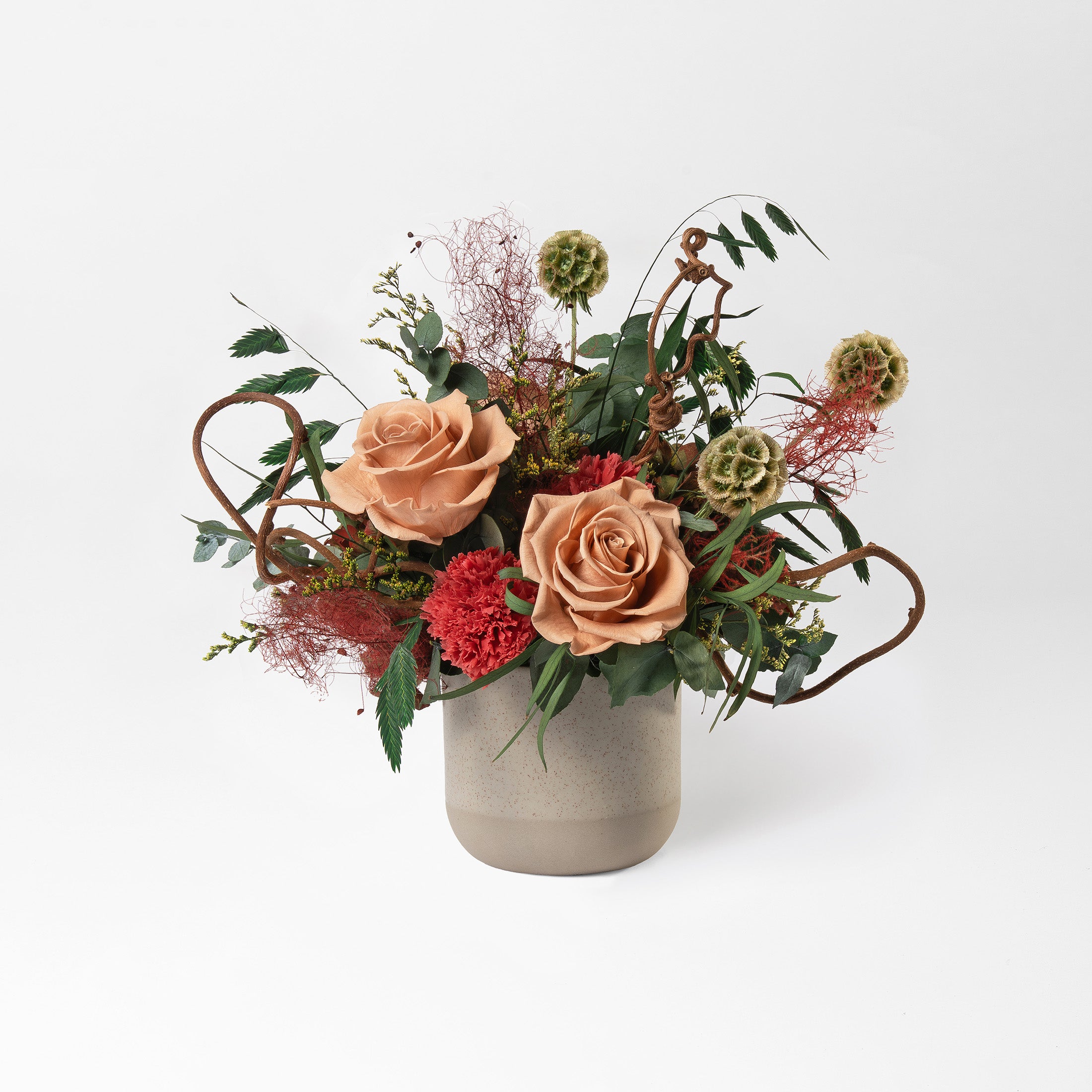 Preserved floral arrangement in a ceramic vase