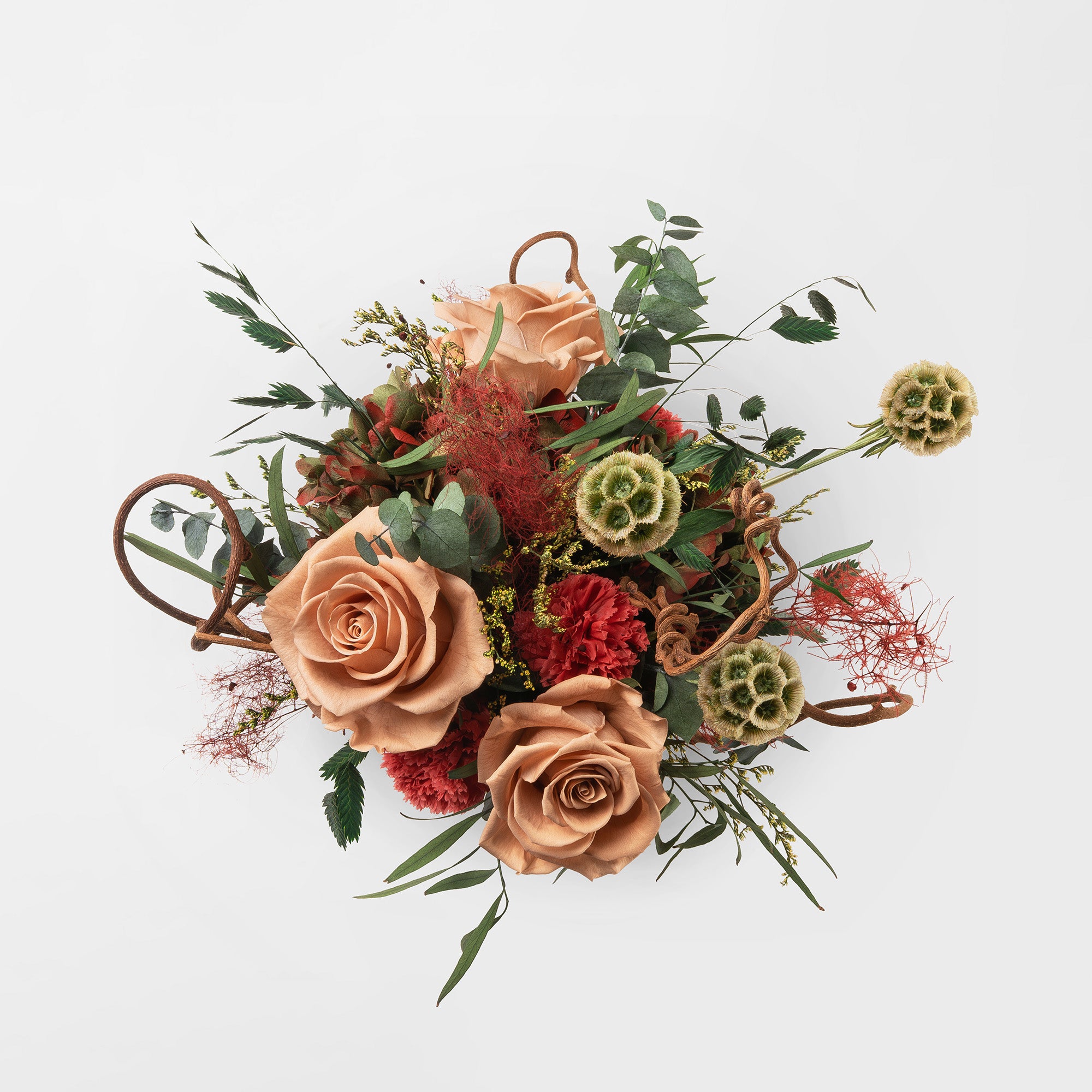 Preserved floral arrangement in a ceramic vase