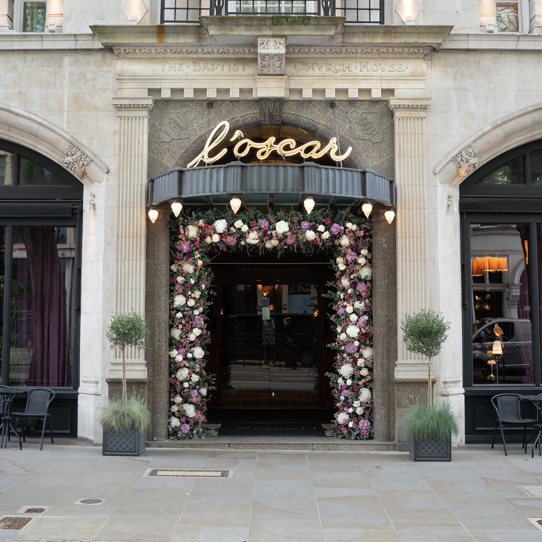 Preserved mixed-flower garland decorating the hotel entrance