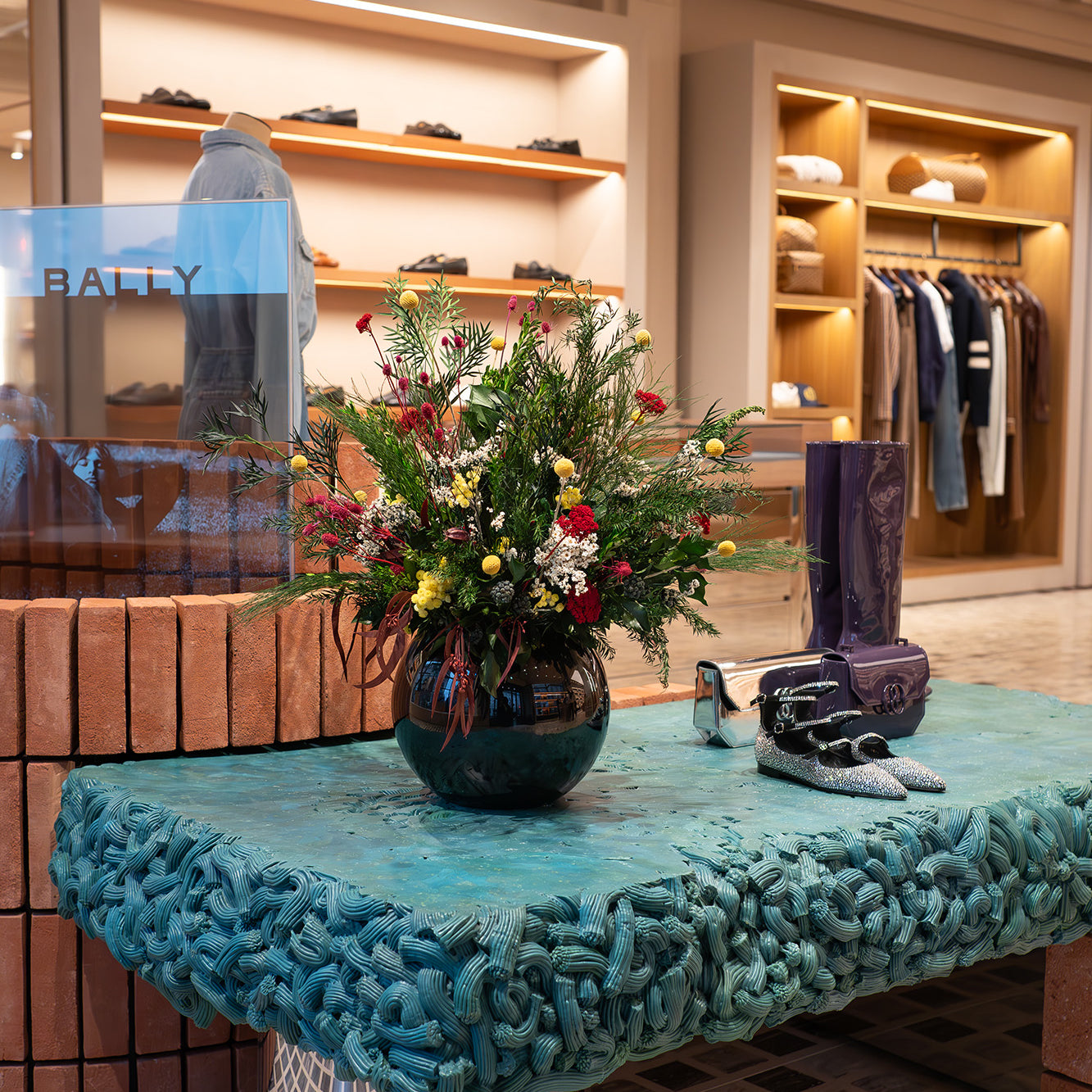 Preserved mixed wild flower arrangement displayed in a luxury store
