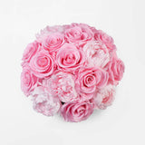 Gold vase with preserved pink roses and peonies