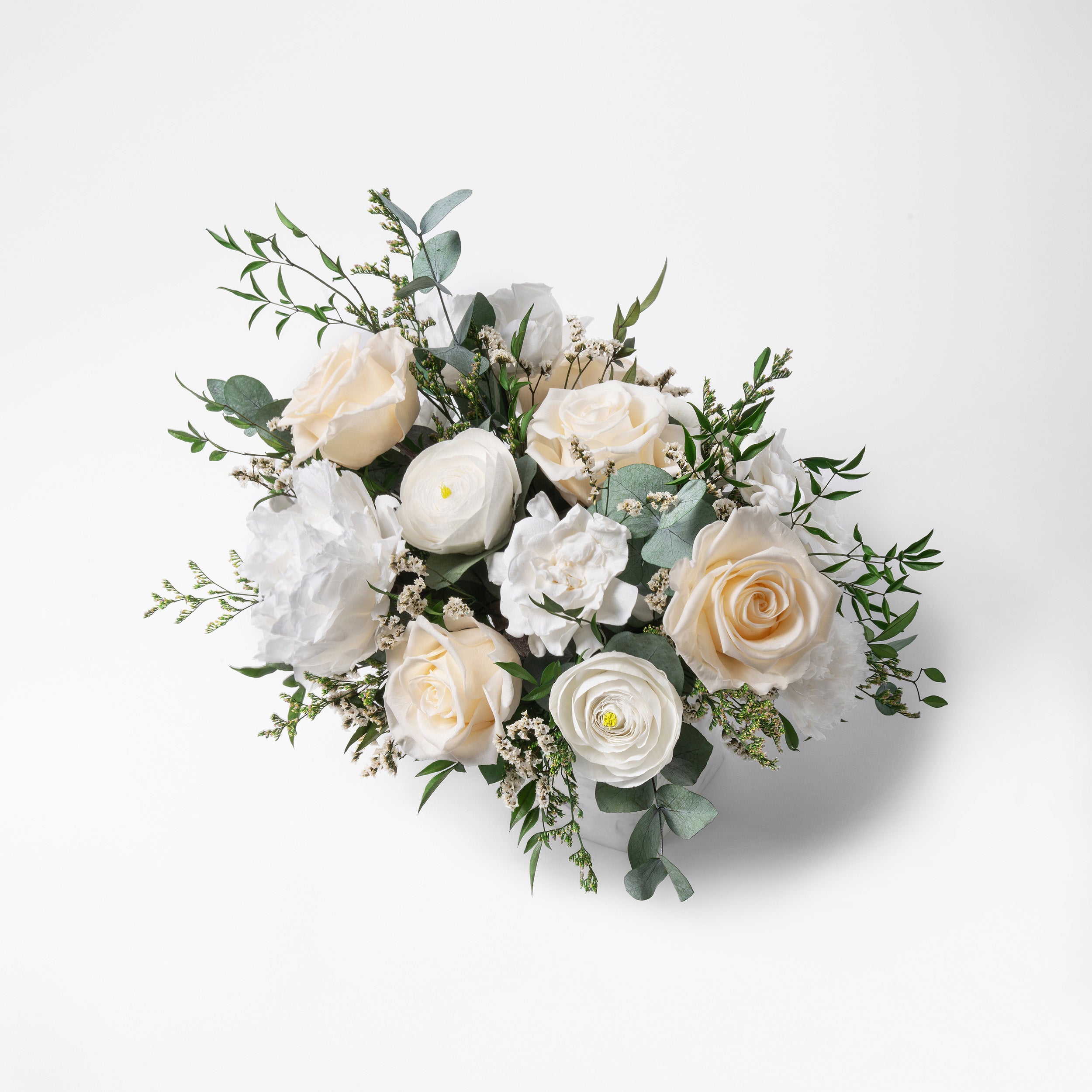 PRESERVED WHITE MIXED FLOWER ARRANGEMENT IN MARBLE VASE