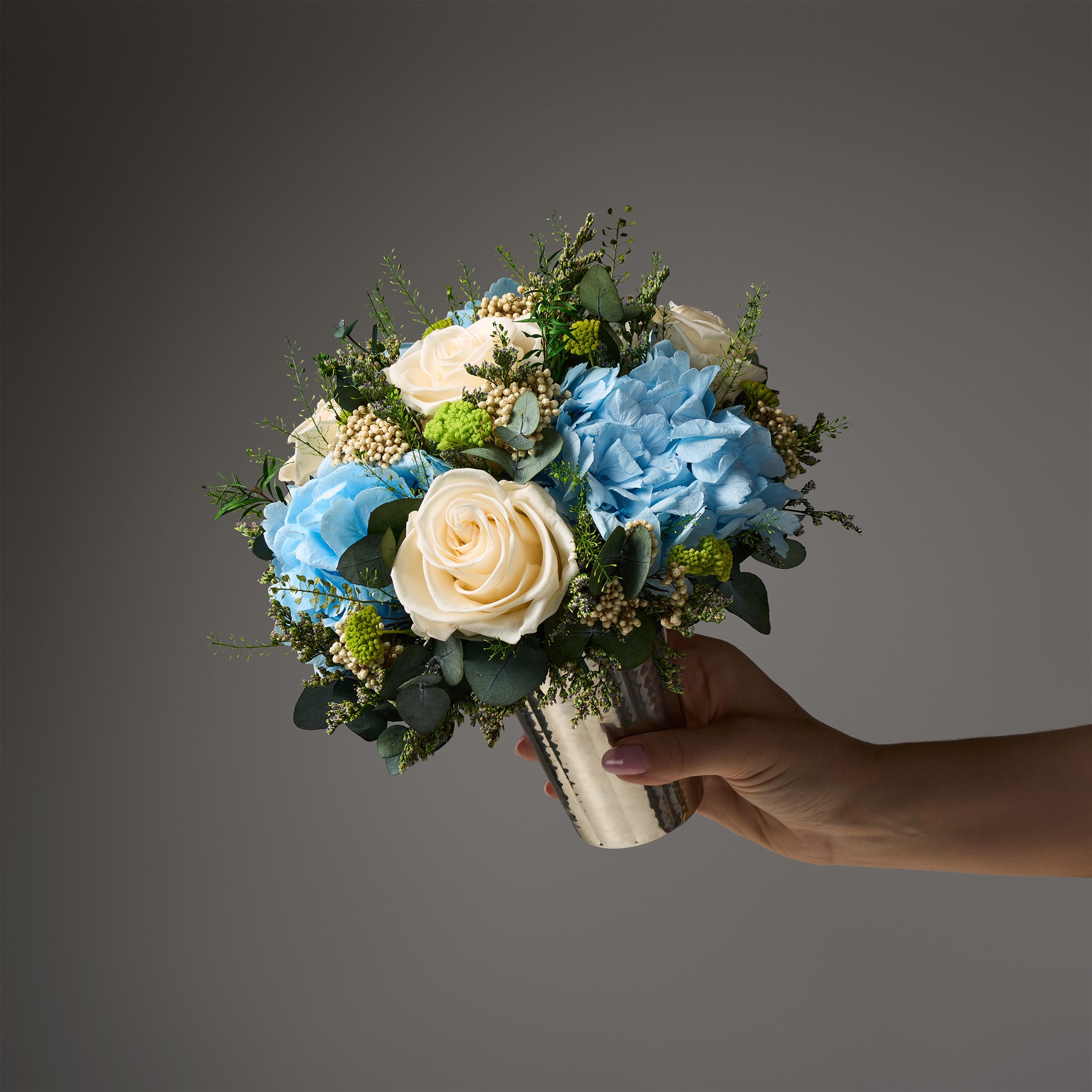 PRESERVED WHITE AND BLUE MIXED FLOWER ARRANGEMENT IN SILVER METAL VASE