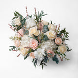 PRESERVED BLUSH AND WHITE MIXED FLOWER ARRANGEMENT IN WHITE CERAMIC VASE