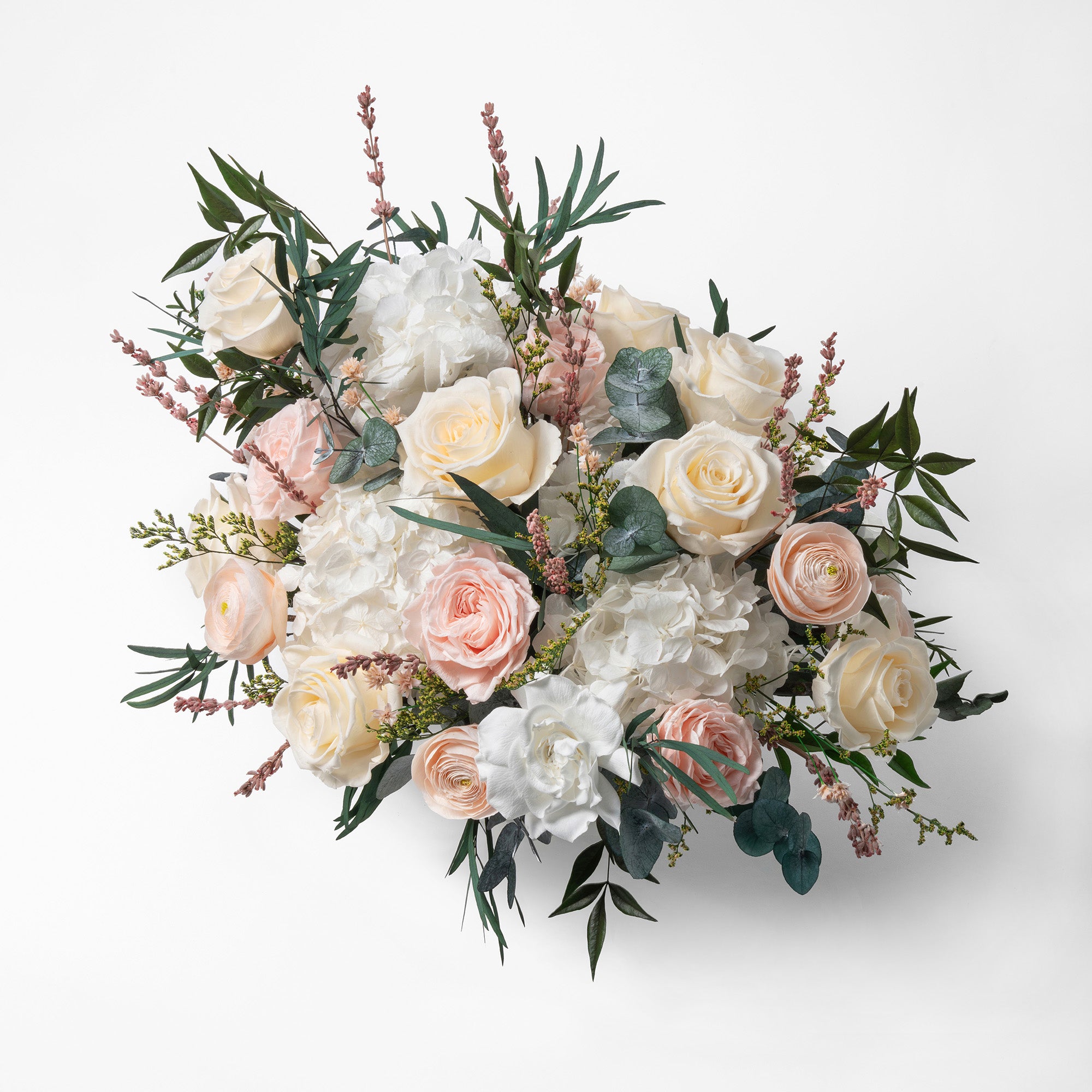 PRESERVED BLUSH AND WHITE MIXED FLOWER ARRANGEMENT IN WHITE CERAMIC VASE