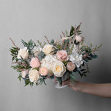 PRESERVED BLUSH AND WHITE MIXED FLOWER ARRANGEMENT IN WHITE CERAMIC VASE