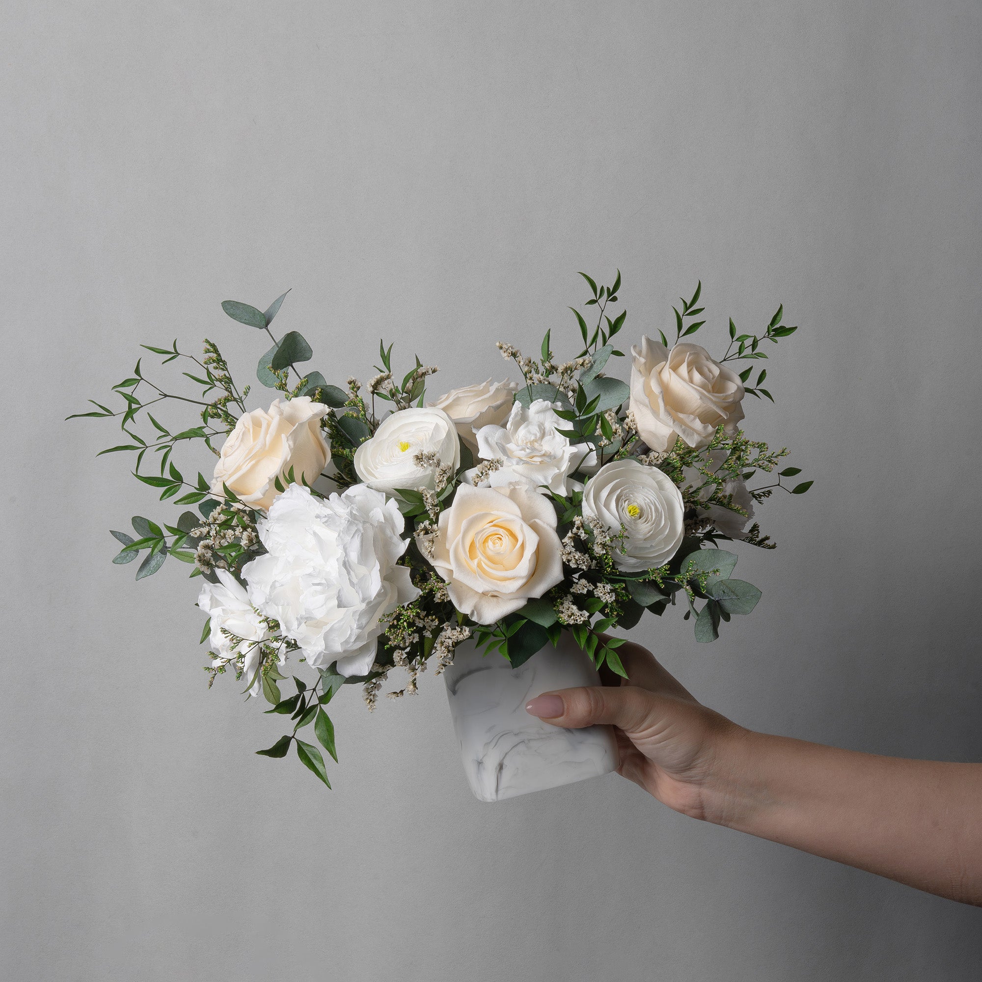 PRESERVED WHITE MIXED FLOWER ARRANGEMENT IN MARBLE VASE