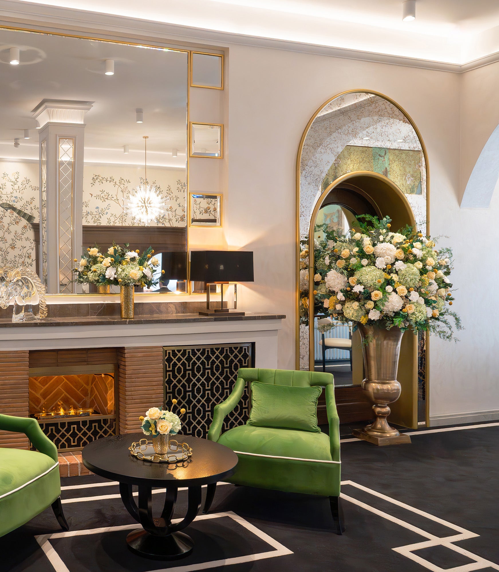 Preserved yellow and green mixed flower arrangements in a hotel lobby