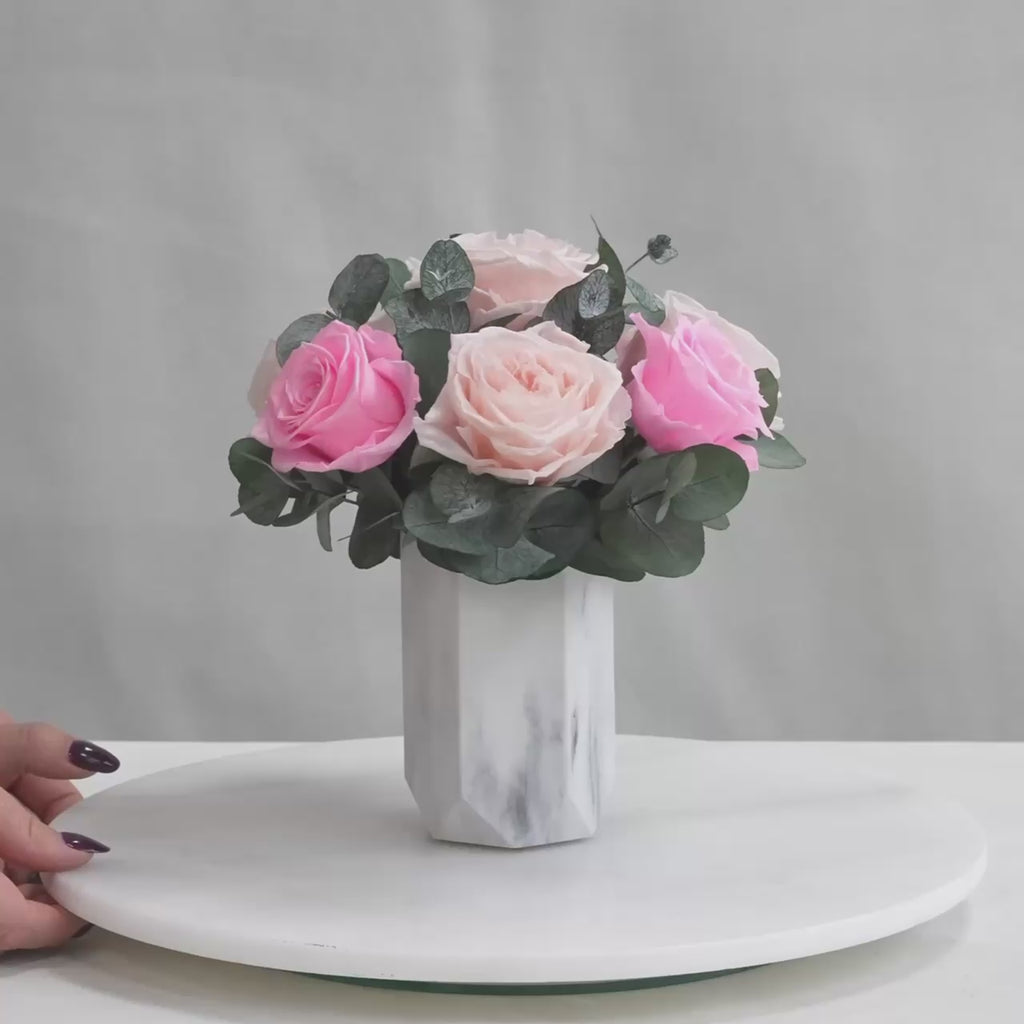 PRESERVED PINK ROSE ARRANGEMENT IN MARBLE VASE