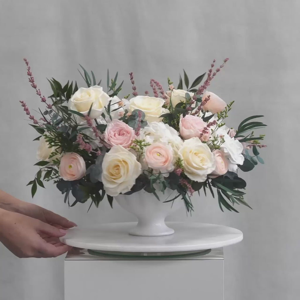 PRESERVED BLUSH AND WHITE MIXED FLOWER ARRANGEMENT IN WHITE CERAMIC VASE